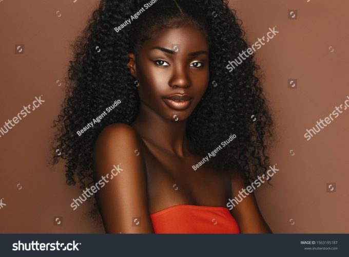 stock-photo-african-beautiful-woman-portrait-brunette-curly-haired-young-model-with-dark-skin-and-perfect-smile-1563195187