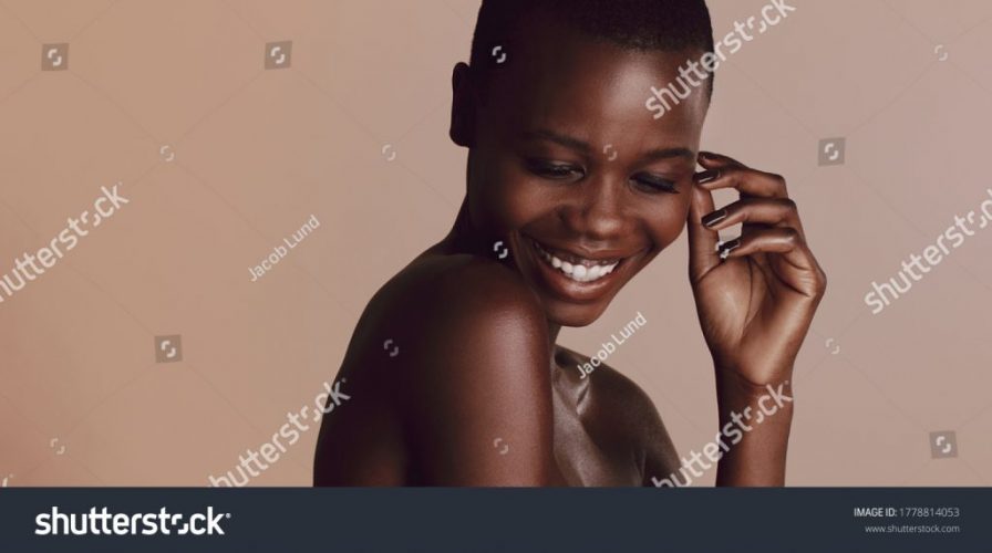 stock-photo-african-woman-with-buzz-cut-hairstyle-looking-down-and-smiling-female-fashion-model-smiling-1778814053