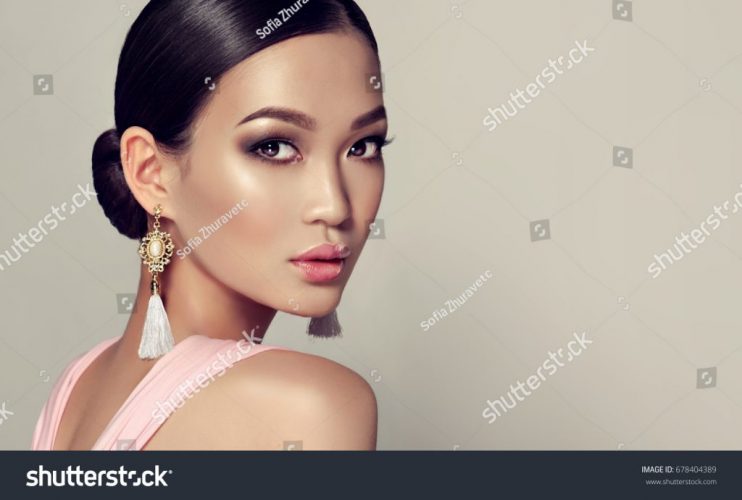 stock-photo-asian-model-fashion-girl-with-tassel-earrings-and-pink-dress-678404389