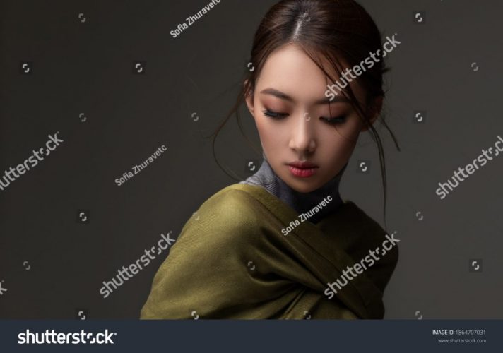 stock-photo-beautiful-asian-woman-in-a-green-shawl-beauty-of-mysterious-chinese-girl-with-flowing-hair-1864707031