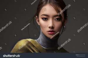 stock-photo-beautiful-asian-woman-in-a-green-shawl-beauty-of-mysterious-chinese-girl-with-flowing-hair-1869367339