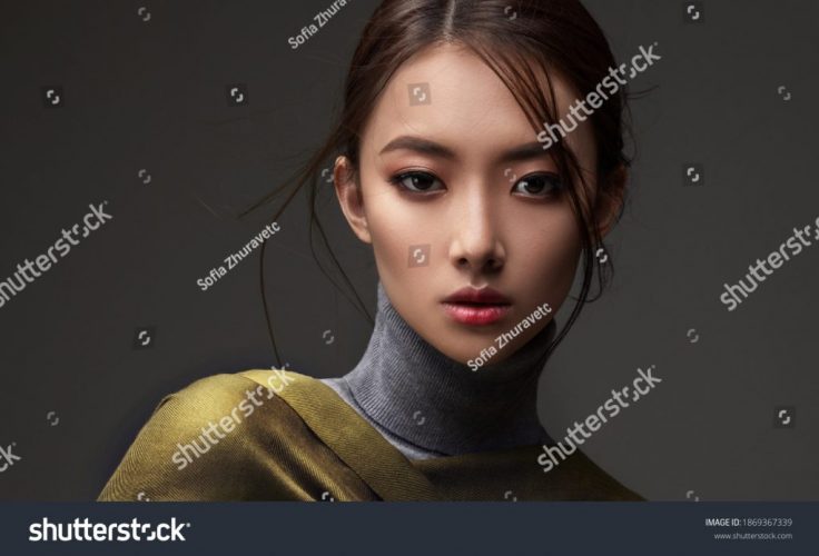 stock-photo-beautiful-asian-woman-in-a-green-shawl-beauty-of-mysterious-chinese-girl-with-flowing-hair-1869367339