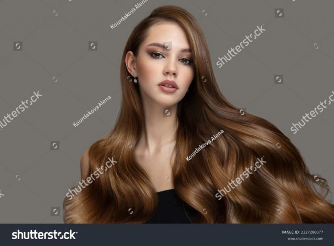 stock-photo-beautiful-fashion-woman-long-curly-big-curls-hair-and-makeup-2127288077