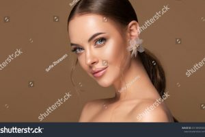 stock-photo-beautiful-girl-fashionable-and-stylish-woman-in-trendy-jewelry-big-earrings-curly-ponytail-2013850082