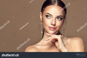 stock-photo-beautiful-girl-fashionable-and-stylish-woman-in-trendy-jewelry-big-earrings-fashion-look-1614158497