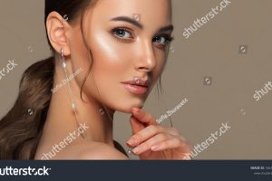 stock-photo-beautiful-girl-with-curled-tail-on-her-head-fashionable-and-stylish-woman-in-trendy-jewelry-big-1661329555