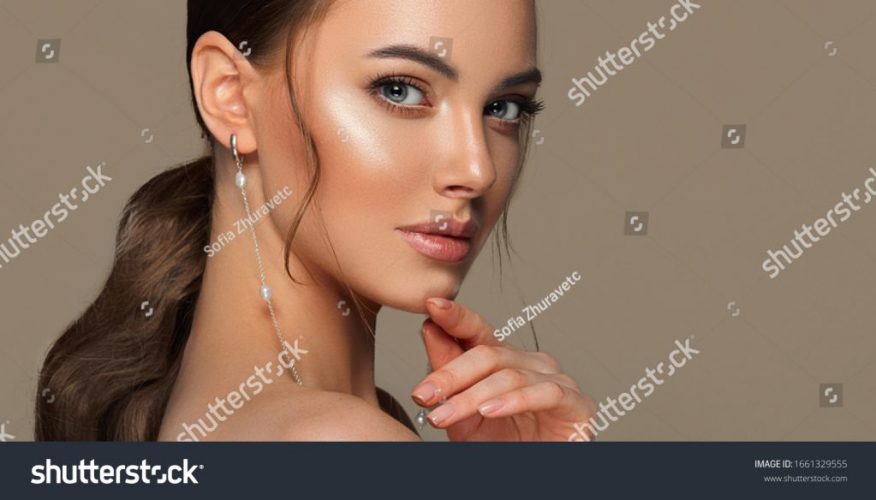 stock-photo-beautiful-girl-with-curled-tail-on-her-head-fashionable-and-stylish-woman-in-trendy-jewelry-big-1661329555