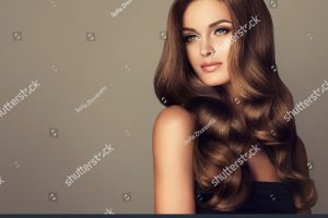 stock-photo-beautiful-girl-with-long-wavy-and-shiny-hair-brunette-woman-with-curly-hairstyle-492086719
