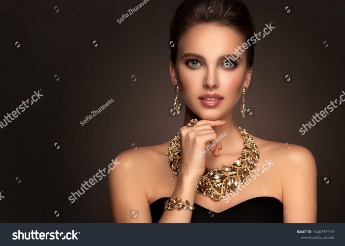 stock-photo-beautiful-girl-with-set-jewelry-woman-in-a-necklace-with-a-ring-earrings-and-a-bracelet-1646736538