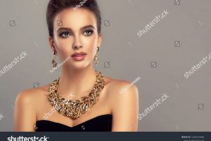 stock-photo-beautiful-girl-with-set-jewelry-woman-in-a-necklace-with-a-ring-earrings-and-a-bracelet-1646919688
