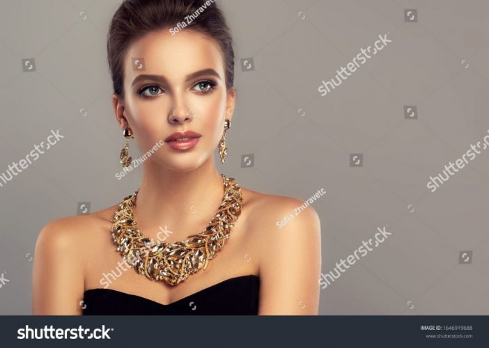 stock-photo-beautiful-girl-with-set-jewelry-woman-in-a-necklace-with-a-ring-earrings-and-a-bracelet-1646919688