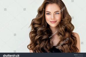 stock-photo-beautiful-laughing-brunette-model-girl-with-long-curly-hair-smiling-woman-hairstyle-wavy-1714972672