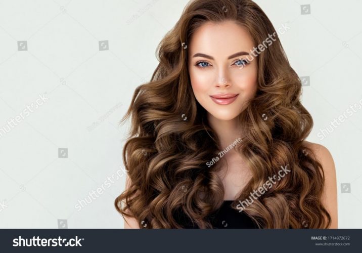 stock-photo-beautiful-laughing-brunette-model-girl-with-long-curly-hair-smiling-woman-hairstyle-wavy-1714972672