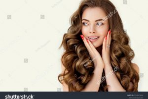 stock-photo-beautiful-laughing-brunette-model-girl-with-long-curly-hair-smiling-woman-hairstyle-wavy-1714972846