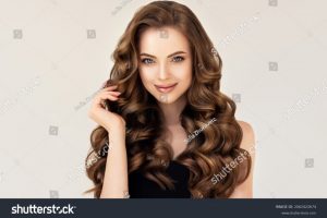 stock-photo-beautiful-laughing-brunette-model-girl-with-long-curly-hair-smiling-woman-hairstyle-wavy-2062422674