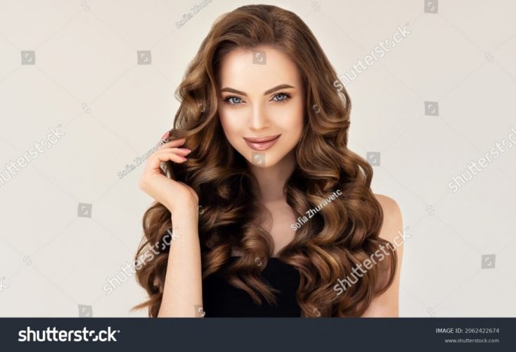stock-photo-beautiful-laughing-brunette-model-girl-with-long-curly-hair-smiling-woman-hairstyle-wavy-2062422674