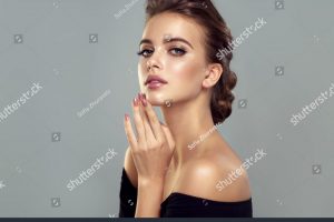 stock-photo-beautiful-model-girl-with-a-charming-smile-and-elegant-hairstyle-woman-with-fashion-style-1254628429
