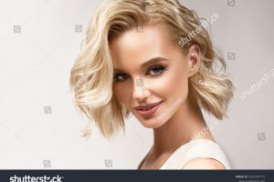 stock-photo-beautiful-model-girl-with-short-hair-beauty-woman-with-blonde-curly-hairstyle-dye-fashion-1935999115