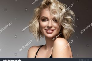 stock-photo-beautiful-model-girl-with-short-hair-beauty-woman-with-blonde-curly-hairstyle-dye-fashion-1993847405