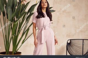 stock-photo-beautiful-sexy-brunette-woman-tanned-skin-face-cosmetic-makeup-wear-pink-suit-pants-for-date-walk-1686851977