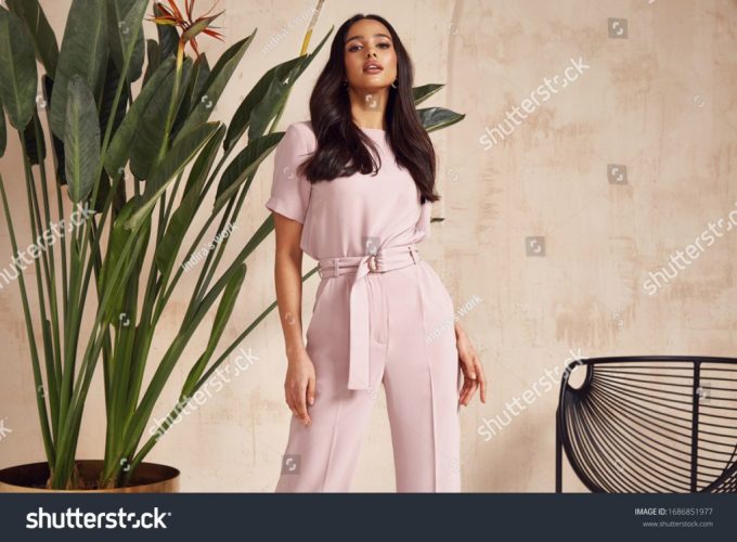 stock-photo-beautiful-sexy-brunette-woman-tanned-skin-face-cosmetic-makeup-wear-pink-suit-pants-for-date-walk-1686851977