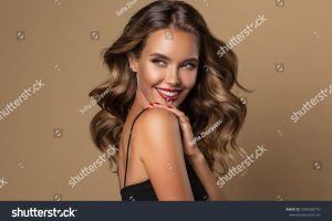 stock-photo-beautiful-smiling-woman-with-long-wavy-hair-girl-curly-hairstyle-and-red-manicure-nails-1896560731