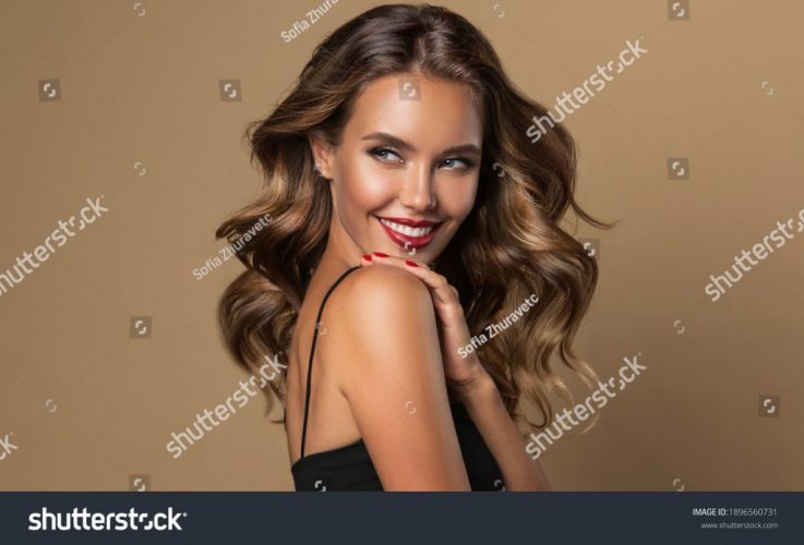 stock-photo-beautiful-smiling-woman-with-long-wavy-hair-girl-curly-hairstyle-and-red-manicure-nails-1896560731