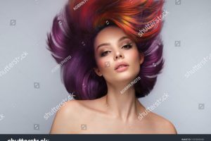 stock-photo-beautiful-woman-with-multi-colored-hair-and-creative-make-up-and-hairstyle-beauty-face-1935809698