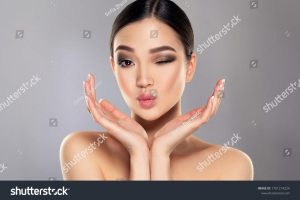 stock-photo-beautiful-young-asian-woman-with-clean-fresh-skin-on-face-oriental-girl-facial-treatment-1751214224