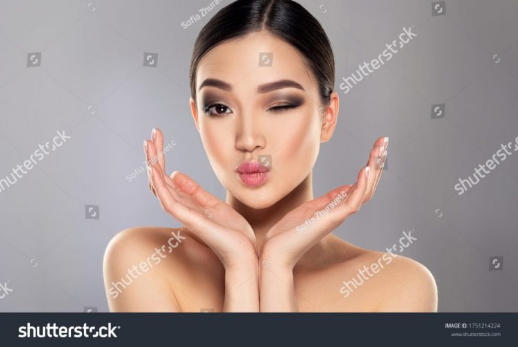 stock-photo-beautiful-young-asian-woman-with-clean-fresh-skin-on-face-oriental-girl-facial-treatment-1751214224