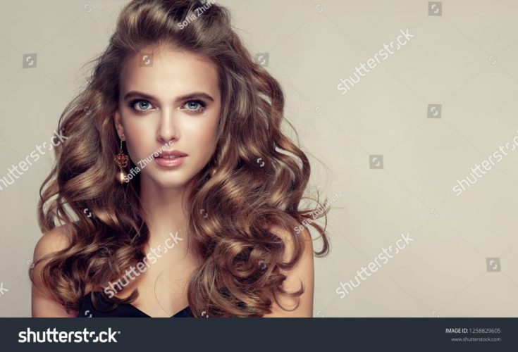 stock-photo-beauty-girl-with-long-and-shiny-wavy-hair-beautiful-woman-model-with-curly-hairstyle-1258829605