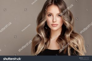 stock-photo-beauty-girl-with-long-and-shiny-wavy-hair-coloring-and-toning-shatush-and-balayash-1922411402