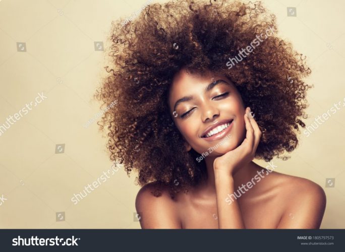 stock-photo-beauty-portrait-of-african-american-woman-with-clean-healthy-skin-on-beige-background-smiling-1805797573