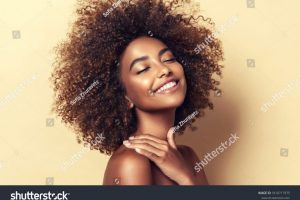 stock-photo-beauty-portrait-of-african-american-woman-with-clean-healthy-skin-on-beige-background-smiling-1810717975