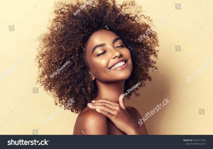 stock-photo-beauty-portrait-of-african-american-woman-with-clean-healthy-skin-on-beige-background-smiling-1810717975