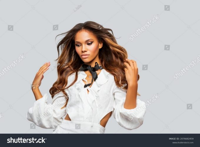 stock-photo-beauty-styled-portrait-of-a-young-african-american-woman-in-white-dress-makeup-fashion-african-2076682459
