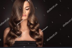 stock-photo-brunette-girl-with-long-and-shiny-wavy-hair-beautiful-model-with-curly-hairstyle-566875267