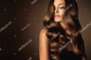 stock-photo-brunette-girl-with-long-and-shiny-wavy-hair-beautiful-model-with-curly-hairstyle-head-and-462075025