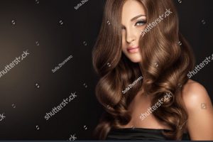 stock-photo-brunette-girl-with-long-and-volume-shiny-wavy-hair-beautiful-woman-model-with-curly-hairstyle-578064478