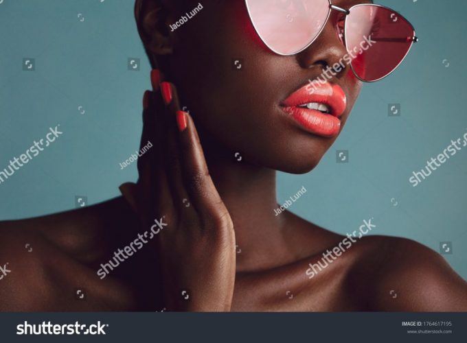 stock-photo-close-up-of-a-glamorous-female-model-with-artistic-makeup-wearing-funky-sunglasses-attractive-1764617195