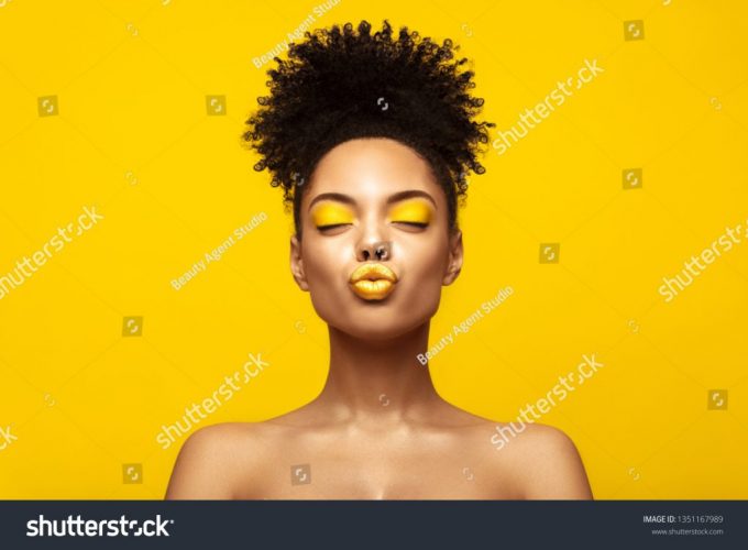 stock-photo-enjoyed-african-american-fashion-model-portrait-satisfied-brunette-young-woman-with-afro-hair-1351167989