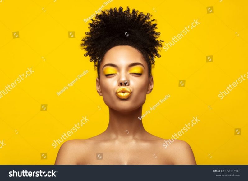 stock-photo-enjoyed-african-american-fashion-model-portrait-satisfied-brunette-young-woman-with-afro-hair-1351167989