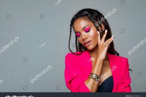stock-photo-fashion-portrait-black-woman-in-pink-stylish-jacket-pink-makeup-curly-hair-and-braids-luxury-2022396515