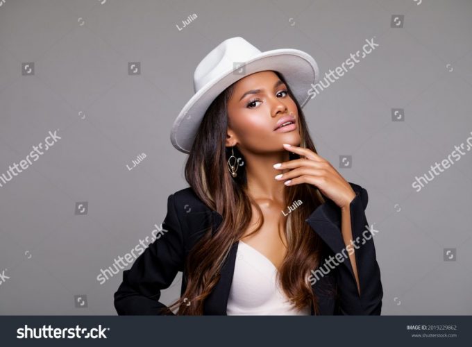 stock-photo-fashion-portrait-of-stylish-black-woman-in-a-hat-makeup-beige-lips-beautiful-model-african-2019229862