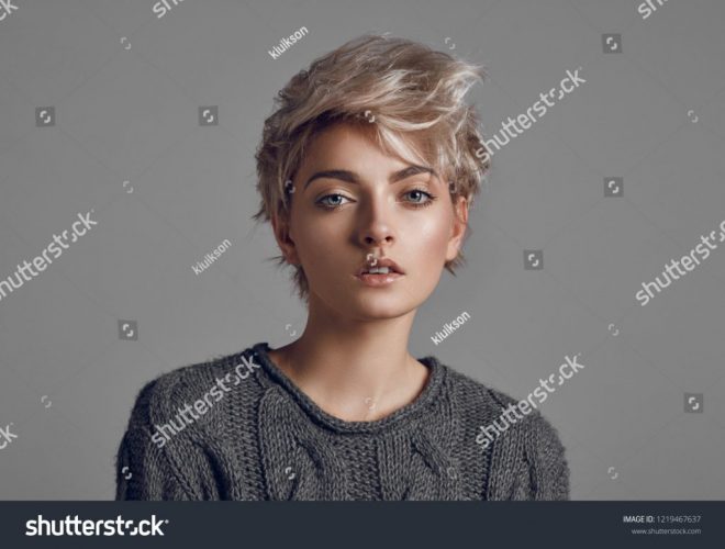 stock-photo-fashion-portrait-of-young-woman-with-blond-short-hair-isoalted-on-gray-background-1219467637