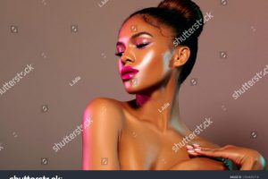 stock-photo-fashion-portrait-with-pink-and-green-a-beautiful-glamor-model-with-stylish-make-up-on-the-face-a-1394839718