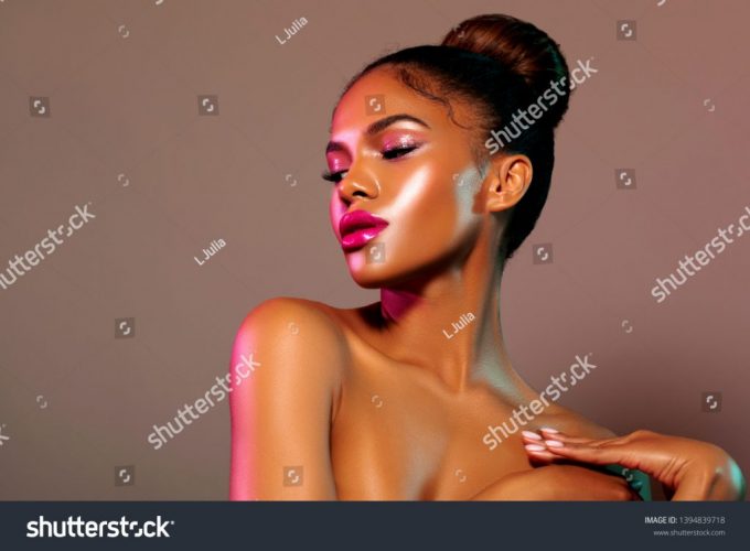 stock-photo-fashion-portrait-with-pink-and-green-a-beautiful-glamor-model-with-stylish-make-up-on-the-face-a-1394839718