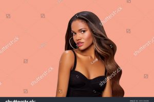 stock-photo-hair-beauty-portrait-of-a-black-woman-with-long-curly-brown-hair-makeup-african-american-model-2095196086
