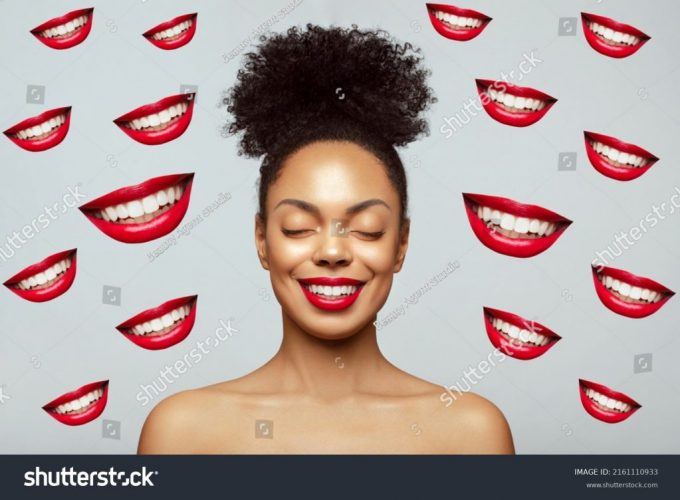 stock-photo-overjoying-young-beautiful-african-american-model-with-closed-eyes-smiling-against-many-smiley-2161110933