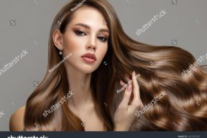 stock-photo-portrait-of-a-beautiful-brunette-woman-with-long-wavy-hair-copycpase-1927331597